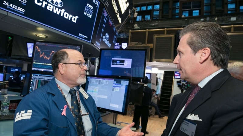 Crawford CFO, Bruce Swain, visits the floor of the New York Stock Exchange.