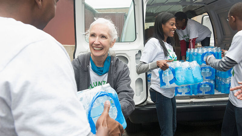 Volunteers distributing bottled water