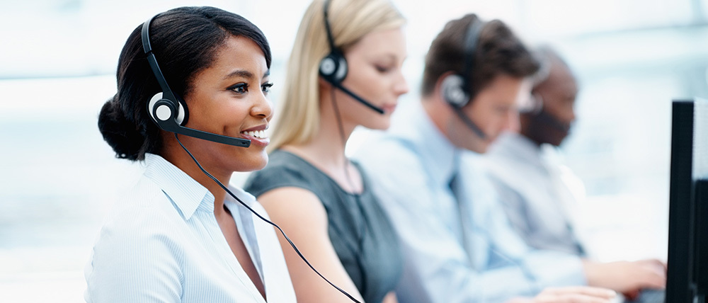 Workers in a contact center responding to incoming phone calls.