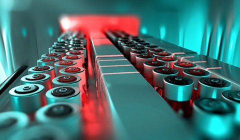 Batteries on a conveyor built in a manufacturing facility