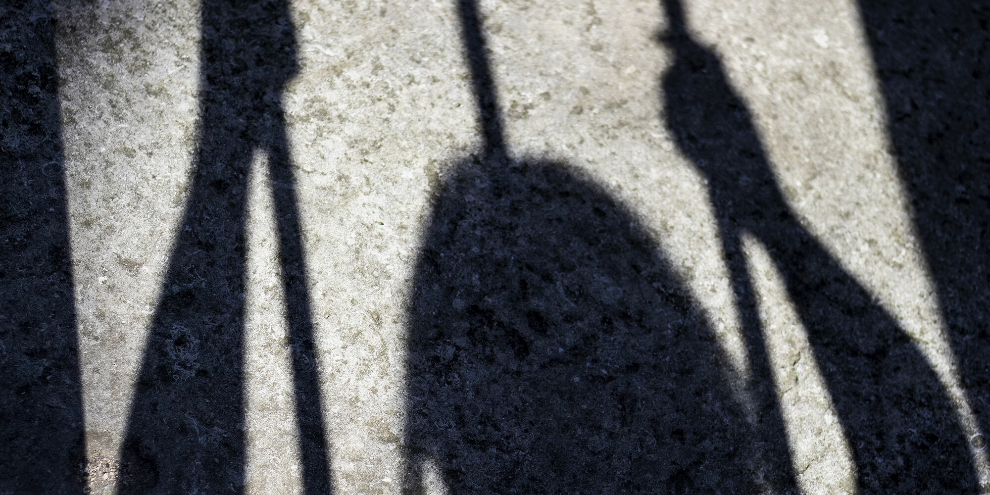 Shadow of young person working in poor conditions