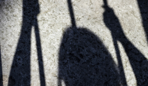 Shadow of young person working in poor conditions